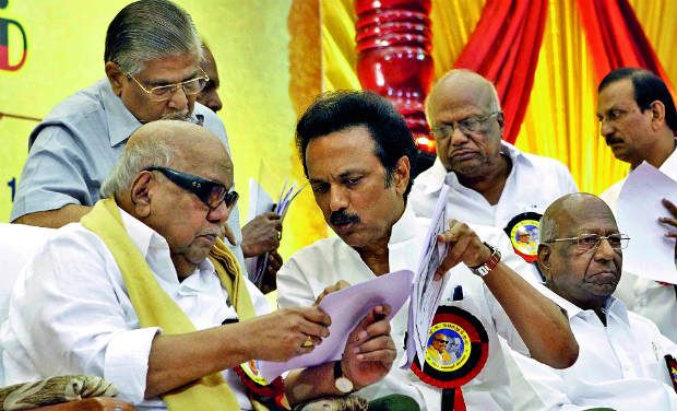 DMK president M. Karunanidhi and his son M.K. Stalin are in deep consultation at a crucial party conclave (Photo: DC archives) DMK president M. Karunanidhi and his son M.K. Stalin are in deep consultation at a crucial party conclave (Photo: DC archives)
